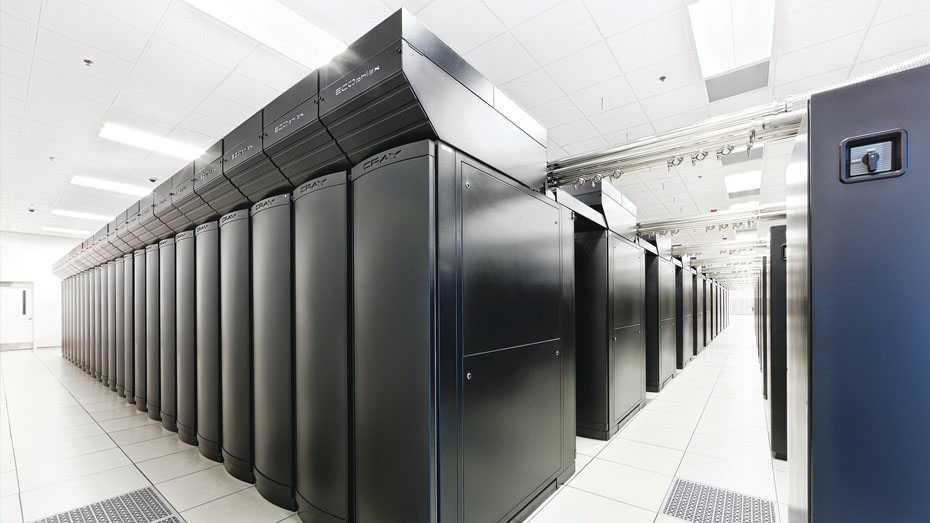 Three quarter view of the Blue Waters supercomputer with its black panels in a brightly lit white room