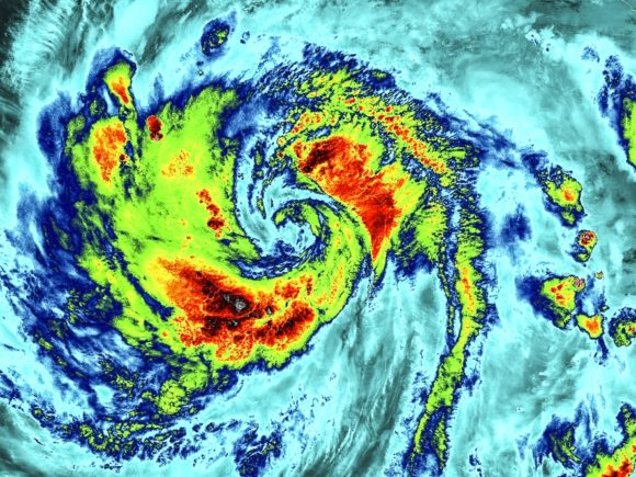 Aerial visualization of a spiraling storm with storm severity shown in black, red, yellow, green, blue, and cyan