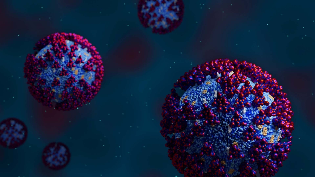 Artistic visualization of multiple floating COVID-19 virus' on a blue background