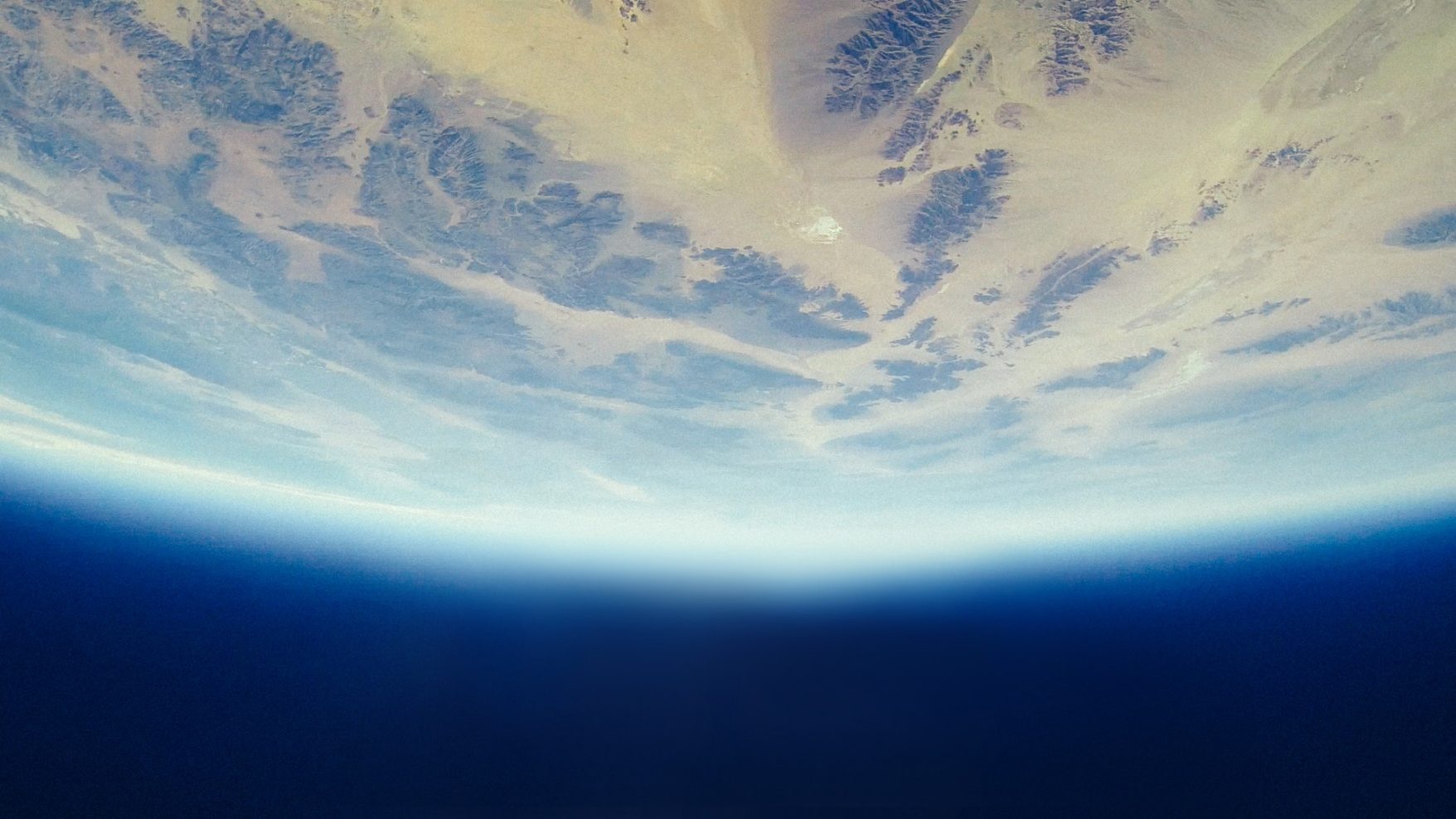 Photograph Earth's atmosphere and landscape from space