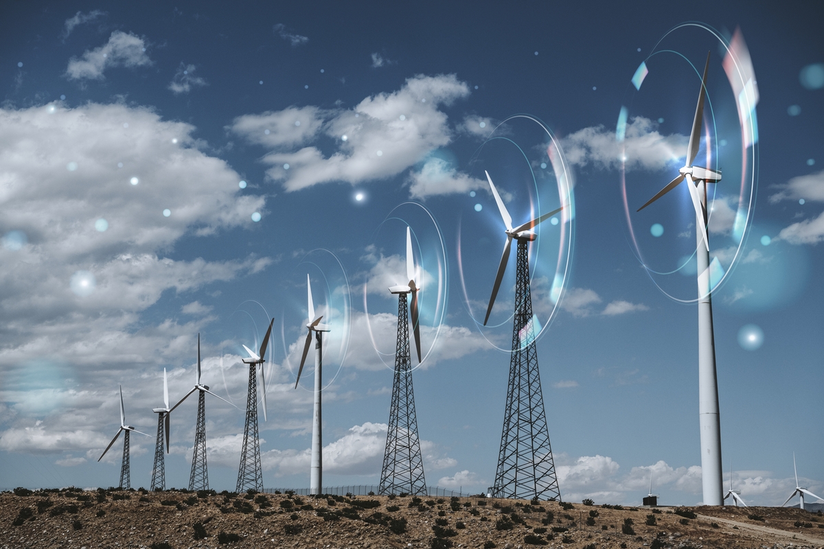 Artistic rendering of wind turbines on a rocky landscape with circles and lens flares signifying movement