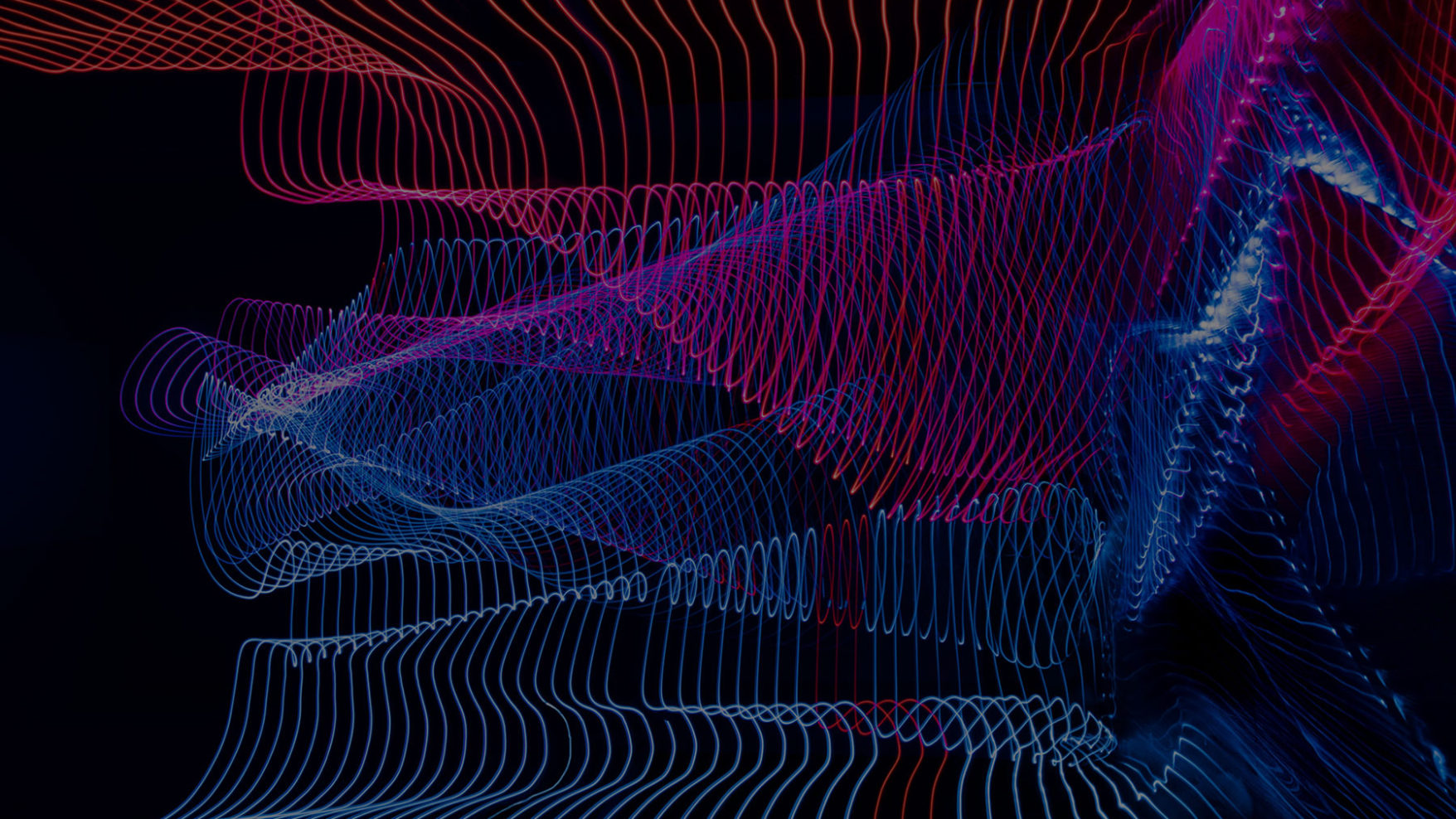 Abstract lines in wave formation that depicts motion from the top to bottom in red and blue