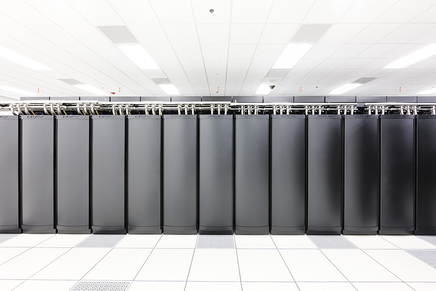 Blue Waters supercomputer black storage drives in a white brightly lit room