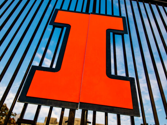 Close-up photograph of the large orange block I logo on the Grange Grove entrance.