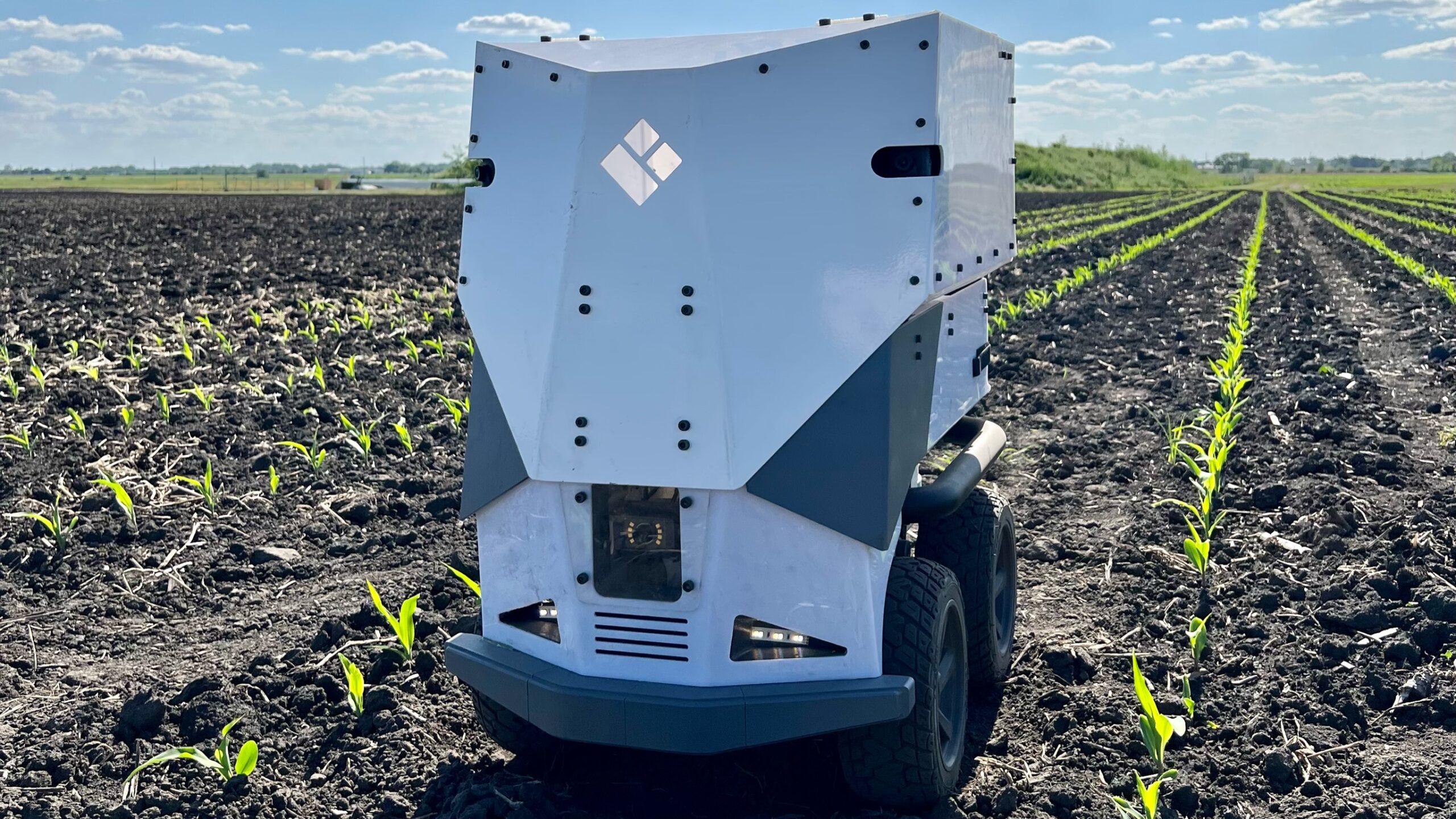 A photo of EarthSense's cover crop robot in a crop plot.