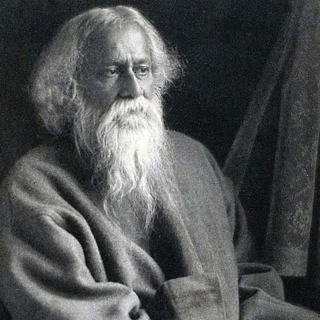 A portrait of Rabindranath Tagore in black and white.