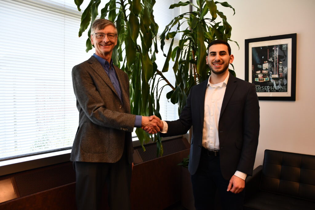 NCSA Director Bill Gropp and 2023 Fiddler Innovation Fellowship winner Bara Saadah shake hands.