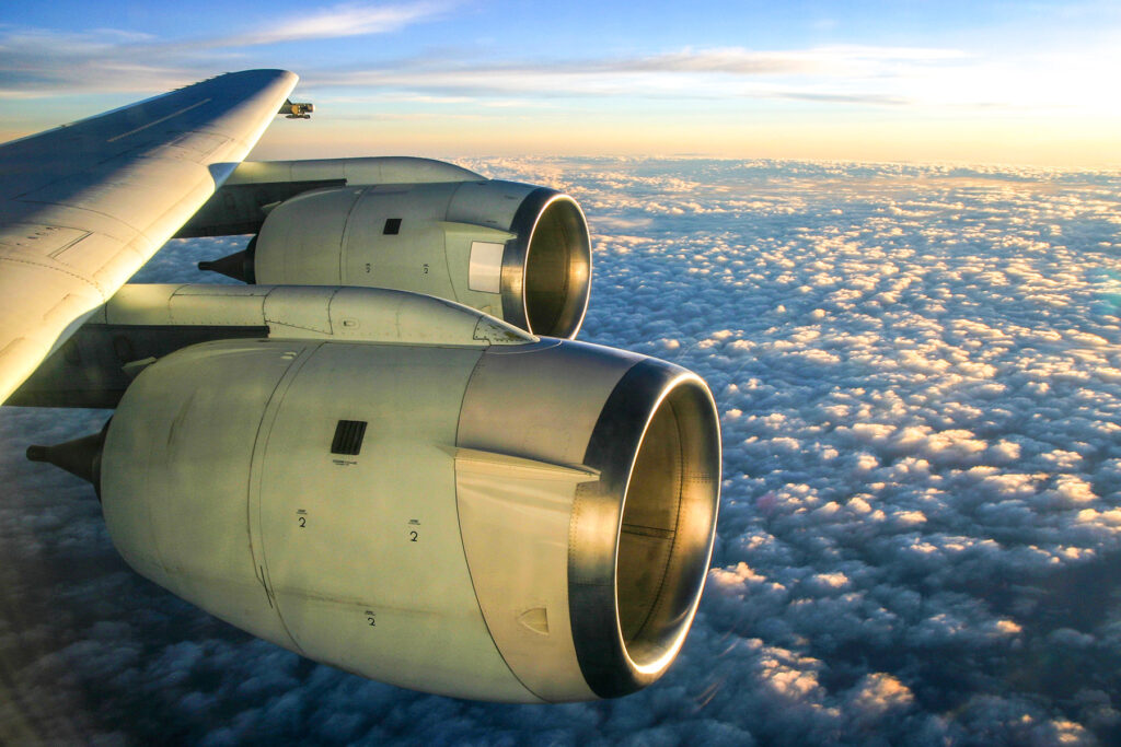 A picture of jet engines as seen out of a plane in flight