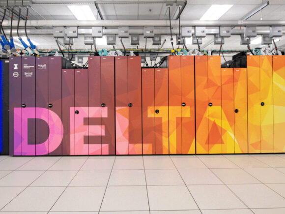 An image of Delta, NCSA's GPU based supercomputer. Delta is spelled out on the supercomputer in colorful geometric shapes reminiscent of a sunset over the water.