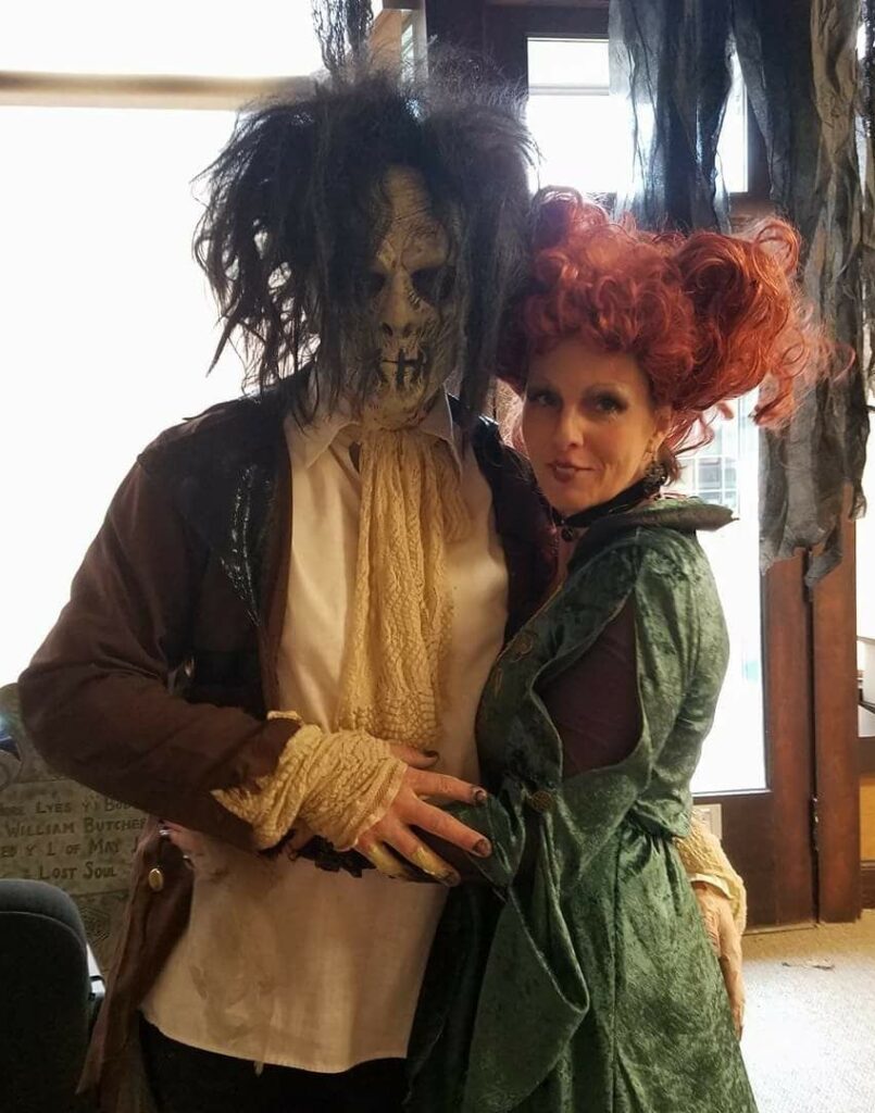 Jeff's wife, Jenny, is dressed like a character from the movie Hocus Pocus. Jeff is wearing elaborate zombie makeup and an outfit from the early 1800s.