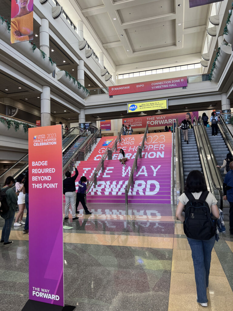 The entrance to the Grace Hopper Conference, "The way forward" is printed on the stairs leading up to the conference.