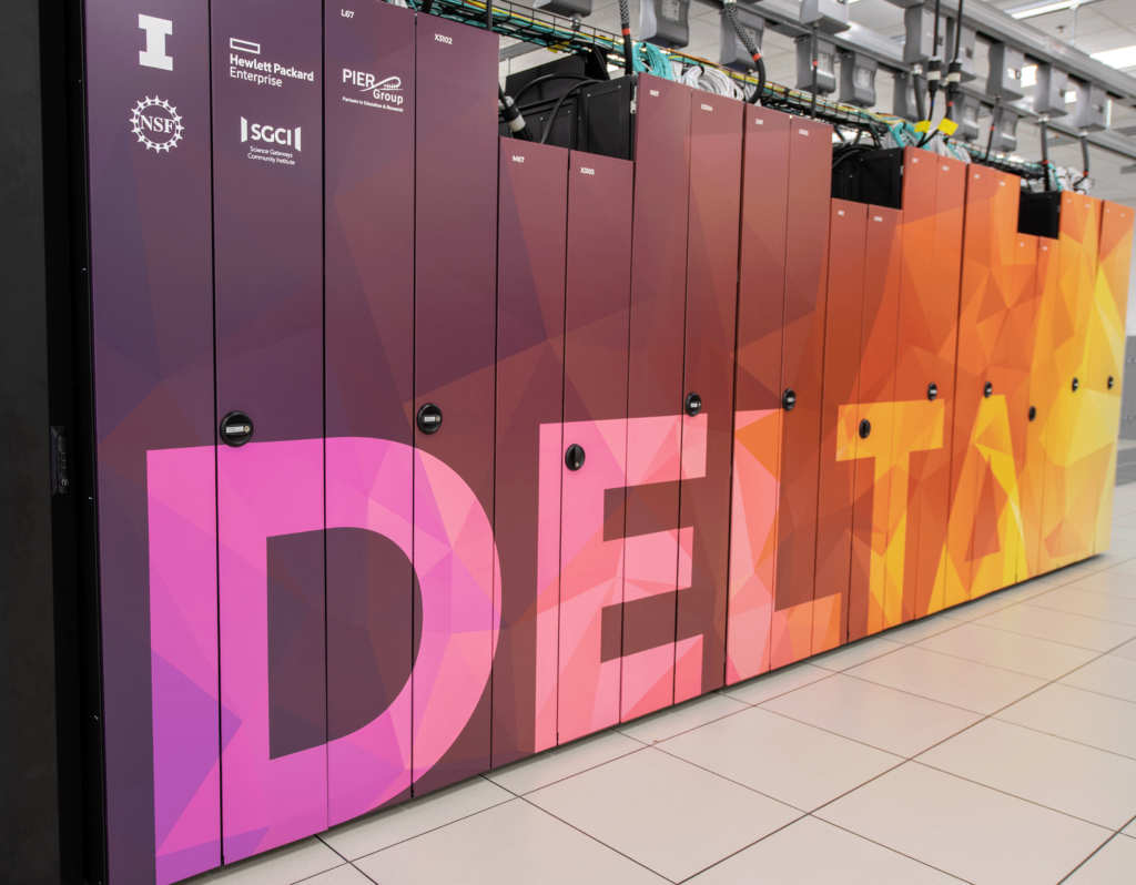 An image of NCSA's Delta supercomputer. The supercomputer is wrapped in a colorful design, the word Delta shifts from violets to oranges and yellows, the colors are in triangular shapes and the A in Delta is the mathematical symbol for Delta.