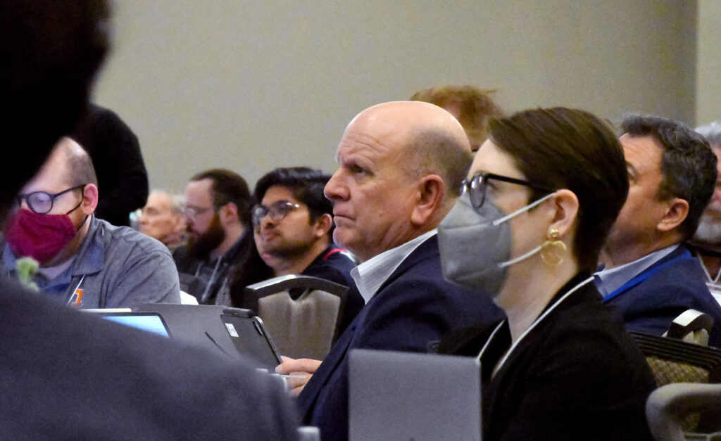 John Reid, executive director, CDA, watches one of the presenters from the audience during the CDA annual conference.