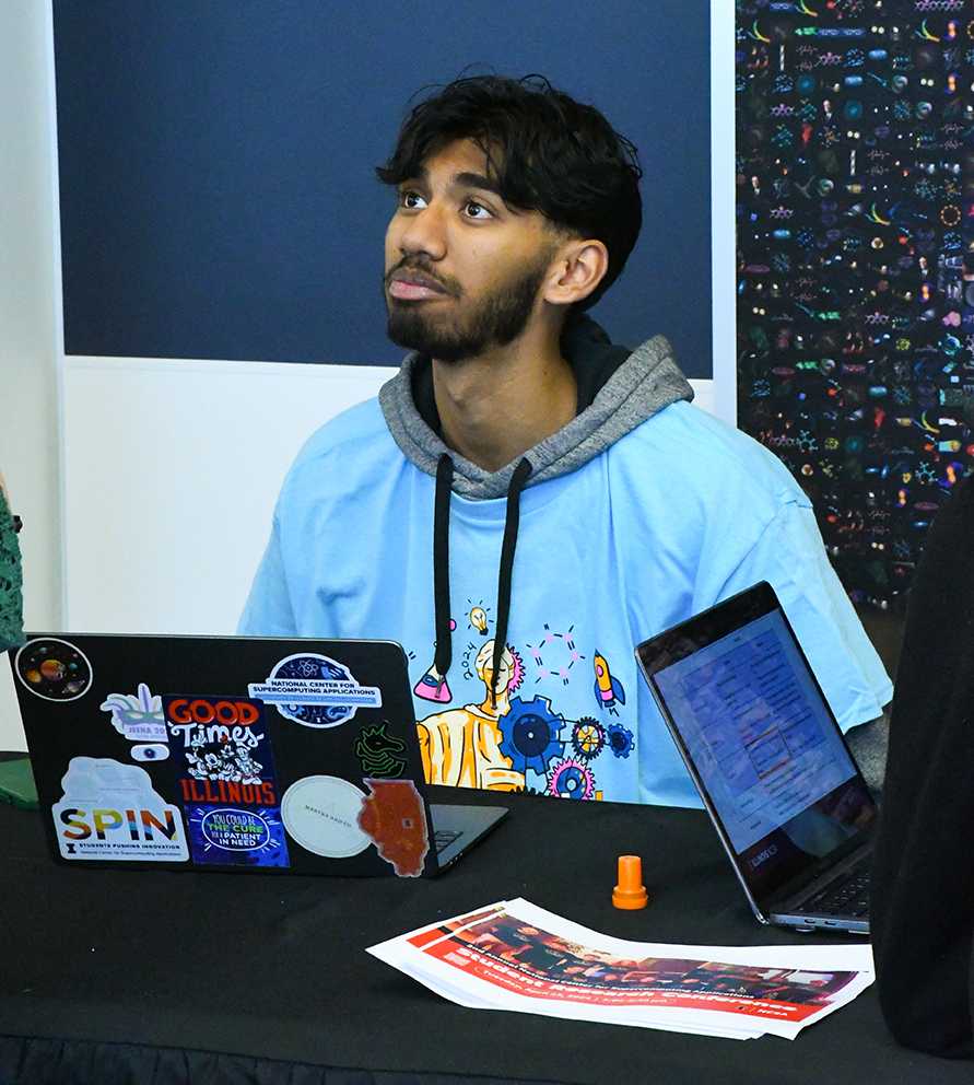 SPIN student, Ayush Das, talks to visitors at EOH.