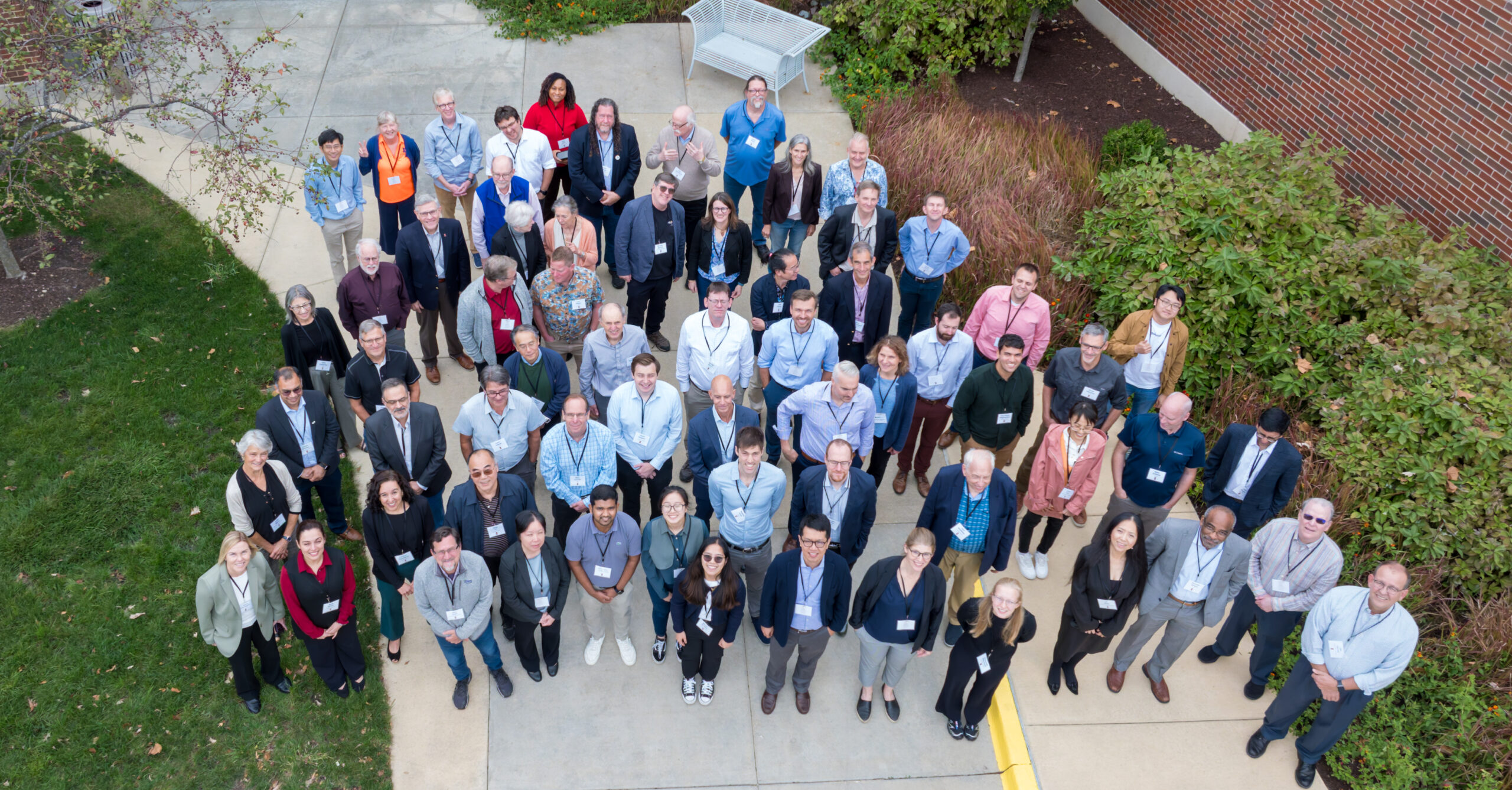 Participants at the International Climate Computer Summit, hosted by NCSA and CLiMAS, look up and smile for a drone photograph. (Photo credit: Darrell Hoemann.)