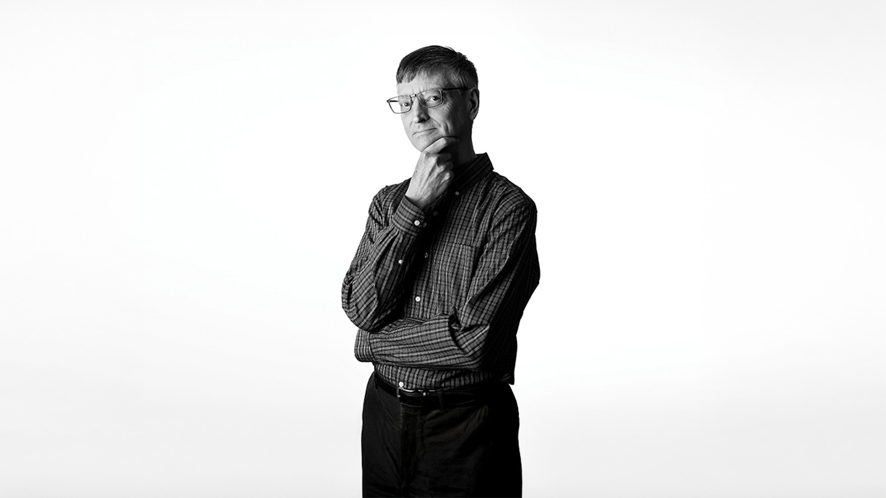 A black and white picture of Bill Gropp. Gropp is photographed against a white background.