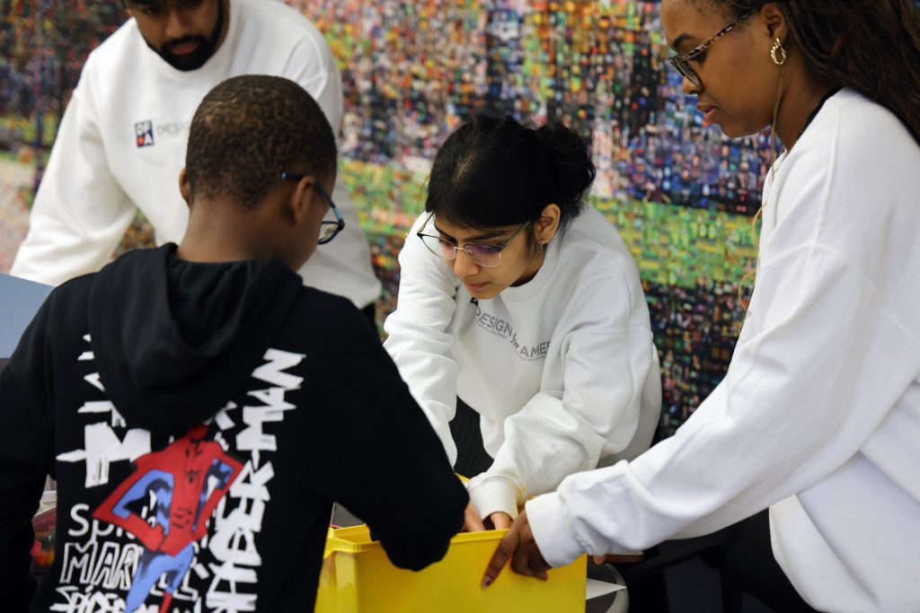 A visitor checks out an EOH booth.