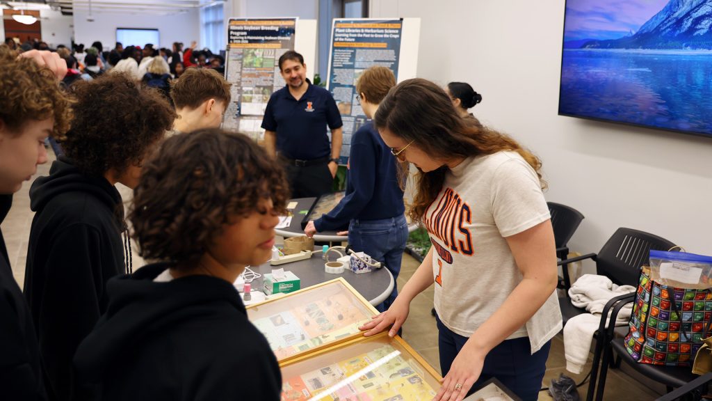 Visitors check out an EOH booth.