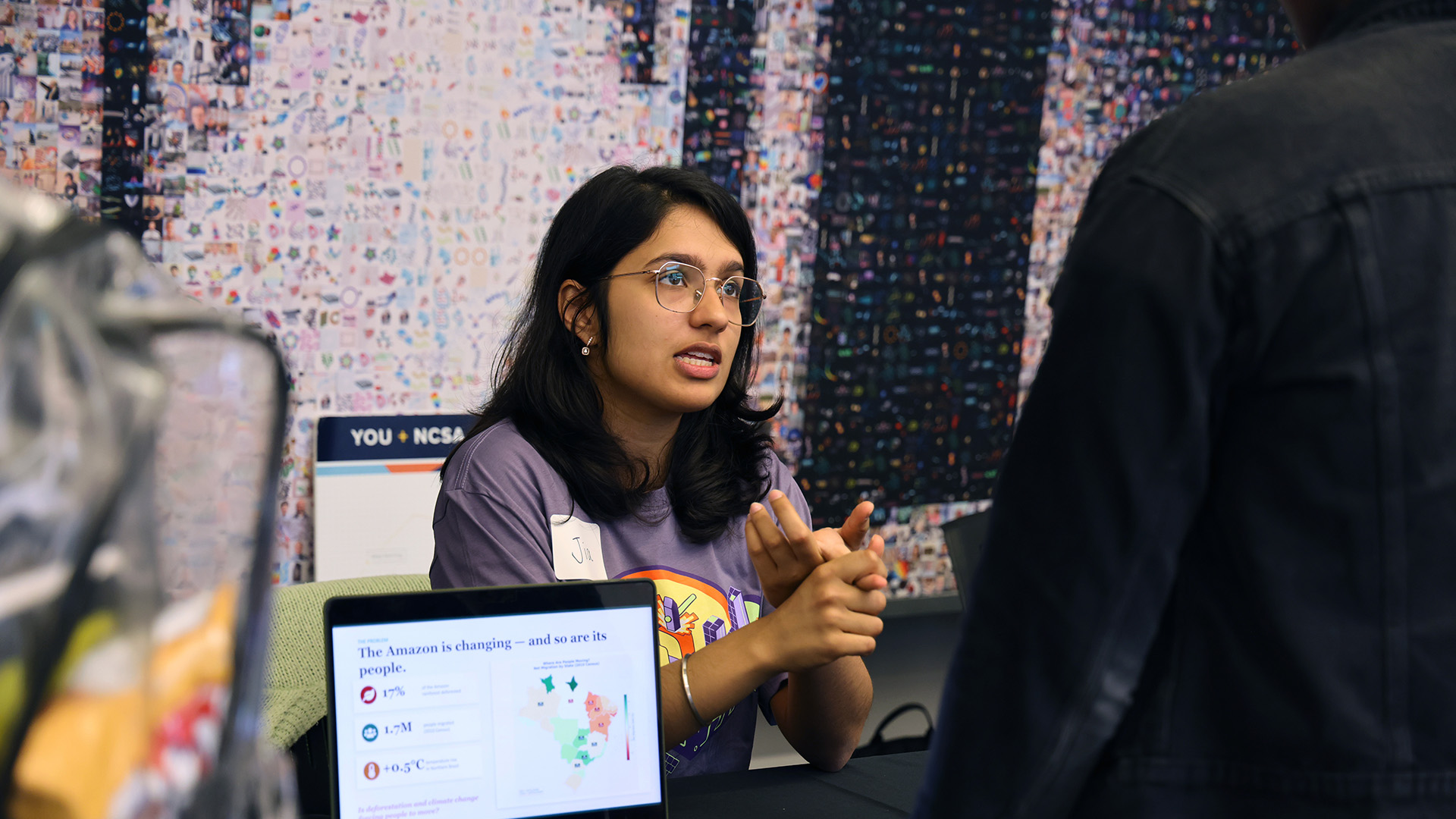 A student helps a visitor.