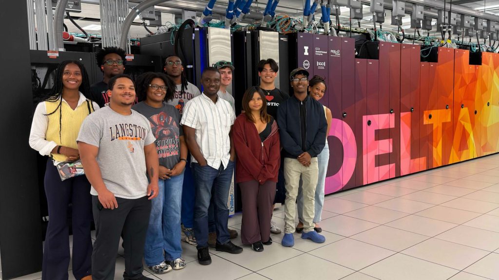The 2026 Center for Digital Agriculture Research Experience for Undergraduates cohort in front of NCSA's Delta supercomputer.